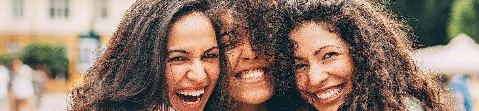 three woman smiling