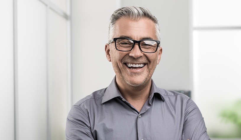 smiling man wearing glasses