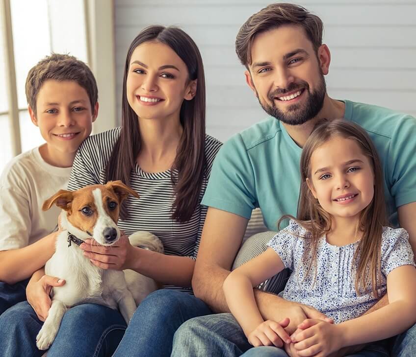 happy young family with their dog