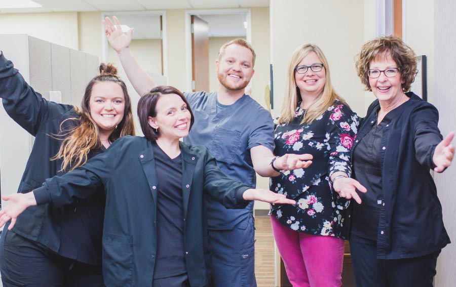 Dr. Chaney's dental team posing for a fun photo.