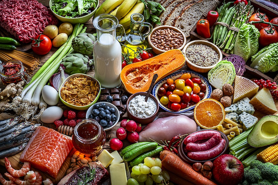 Aerial view of a variety of foods, including fruit, vegetables, dairy products, and meat