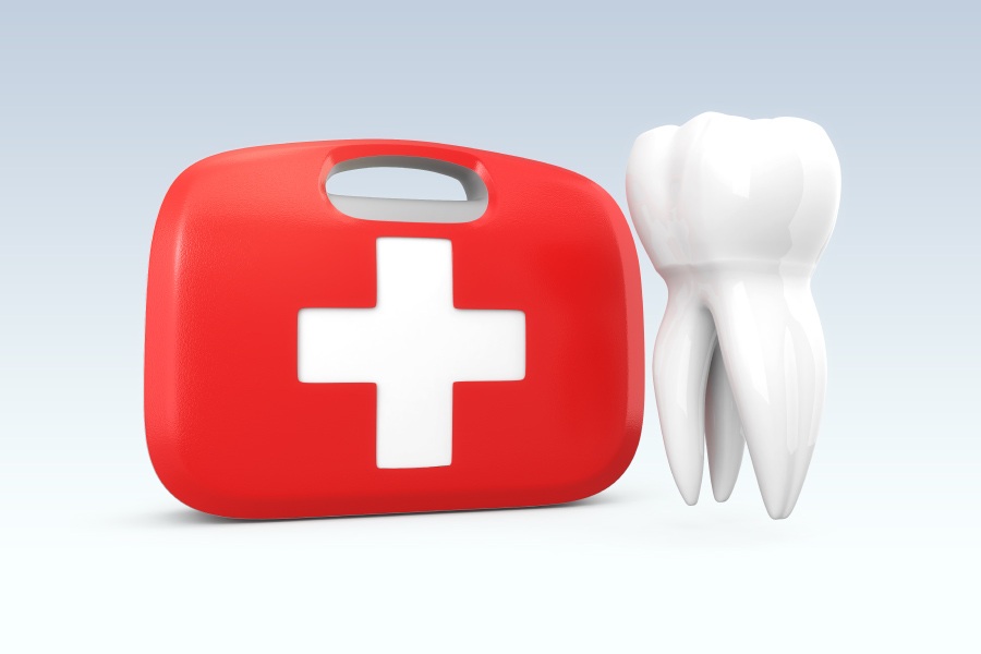 A white tooth floats next to a red and white first aid kit to indicate a dental emergency