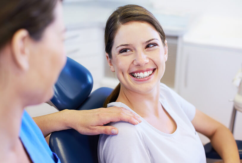 staff member speaking with a patient